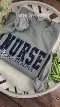 Load and play video in Gallery viewer, NURSE - Rainbow Heartbeat fabric - Trauma Unit, ER,  RN Licensed Practical, CNA, and many more options - Fabric Keepsake Sweatshirts - Applique