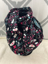 Load image into Gallery viewer, Infinity Scarf with Hidden Zipper Pocket. Nurse RN themed flannel.