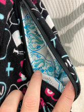 Load image into Gallery viewer, Infinity Scarf with Hidden Zipper Pocket. Nurse RN themed flannel.