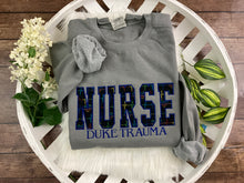 Load image into Gallery viewer, NURSE - Rainbow Heartbeat fabric - Trauma Unit, ER,  RN Licensed Practical, CNA, and many more options - Fabric Keepsake Sweatshirts - Applique
