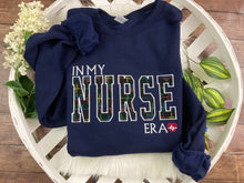 Load image into Gallery viewer, In My NURSE Era Embroidered Sweatshirt - Rainbow Heart EKG Heartbeats  Hospital, rn, crna, labor delivery  Licensed Practical, CNA, Applique
