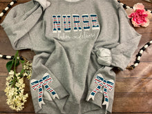 Load image into Gallery viewer, Nurse sweatshirt with side bows from baby hospital swaddle Blanket-  RN labor delivery  Licensed Practical, CNA,  - Fabric Keepsake Sweatshirts - Applique
