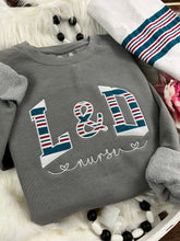 Load image into Gallery viewer, Curved L &amp; D Nurse sweatshirt from baby hospital swaddle Blanket-  RN labor delivery  Licensed Practical, CNA,  - Fabric Keepsake Sweatshirts - Applique
