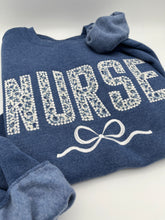 Load image into Gallery viewer, Coquette Nurse Sweatshirt – Appliqué &amp; Embroidered Bow | Custom Department Option. Labor and delivery. Emergency, NICU, Mother Baby, doctor
